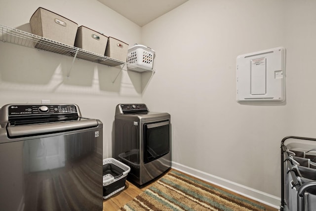 291 Lucca Dr, Summerville, SC 29486 - laundry room with washing machine and dryer and light wood-style flooring
