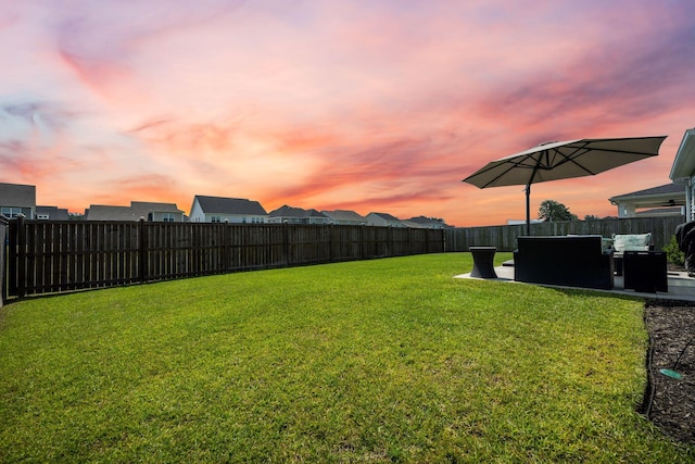 291 Lucca Dr, Summerville, SC 29486 - yard at dusk featuring a fenced backyard and a patio area