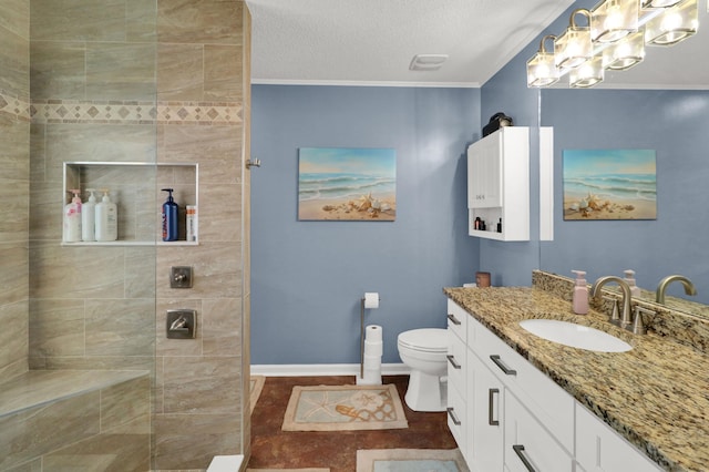 bathroom with vanity, a textured ceiling, ornamental molding, and toilet