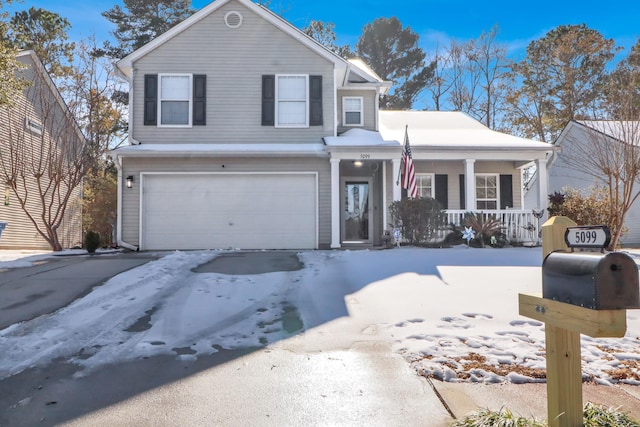 front facade featuring a garage and a porch