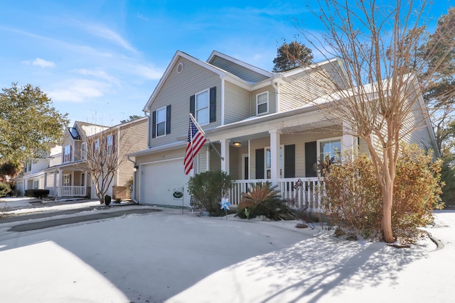 view of front of property with a garage and covered porch