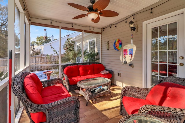 sunroom with ceiling fan