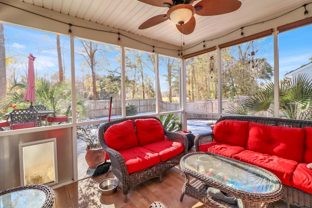 sunroom / solarium with ceiling fan