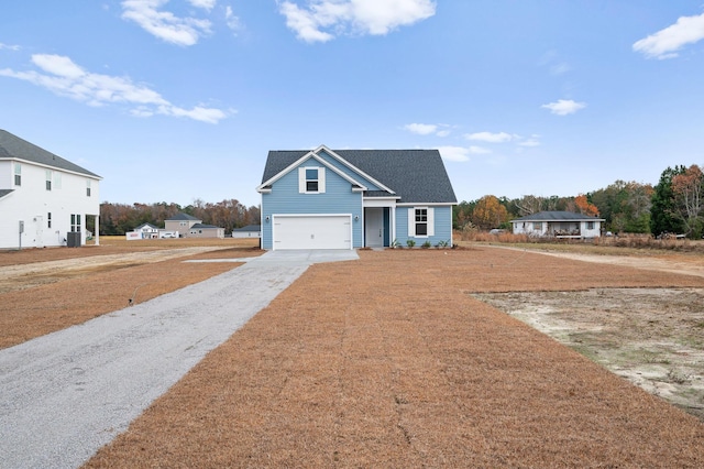 139 Dantzler Rd, Harleyville, SC 29448 - traditional-style home with roof with shingles, driveway, and an attached garage