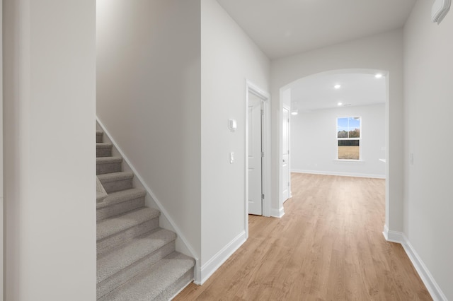 139 Dantzler Rd, Harleyville, SC 29448 - hall with stairway, baseboards, arched walkways, light wood-type flooring, and recessed lighting