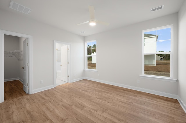 139 Dantzler Rd, Harleyville, SC 29448 - unfurnished bedroom featuring baseboards, visible vents, a spacious closet, and light wood finished floors
