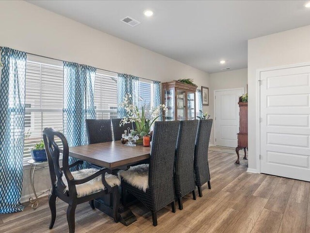 dining space featuring hardwood / wood-style flooring and plenty of natural light