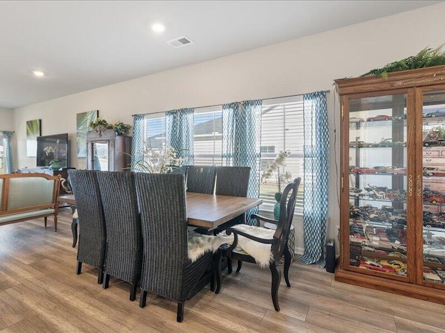 dining area with light hardwood / wood-style flooring