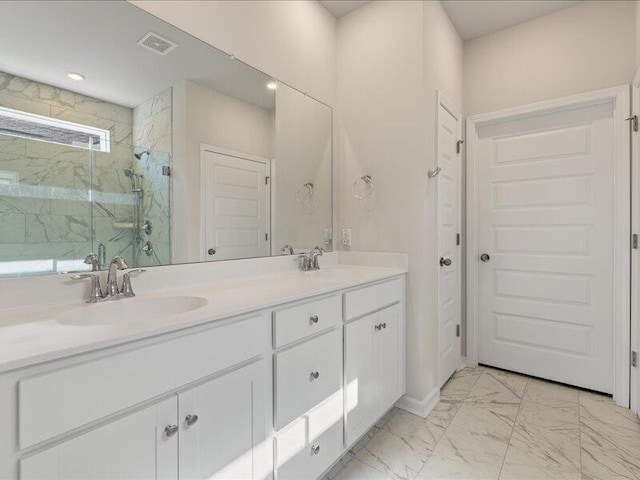 bathroom featuring vanity and walk in shower