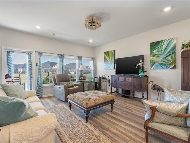 living room with a healthy amount of sunlight and light wood-type flooring