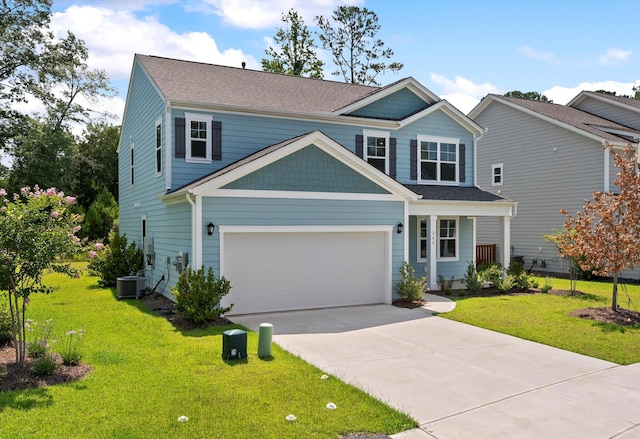 view of front of home featuring a front yard, central AC, and a garage