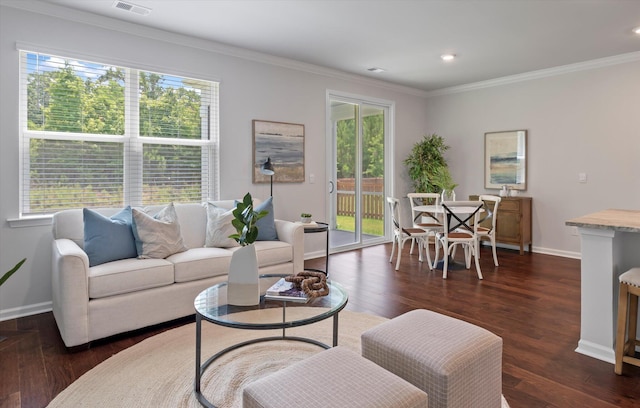 living room with dark wood-type flooring and ornamental molding