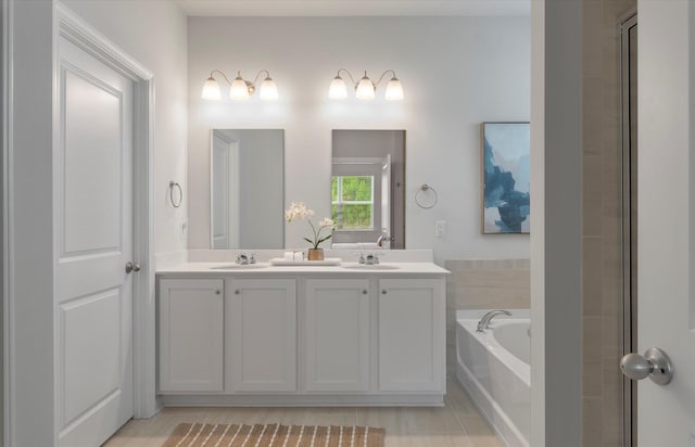 bathroom with tile patterned flooring, vanity, and a tub to relax in