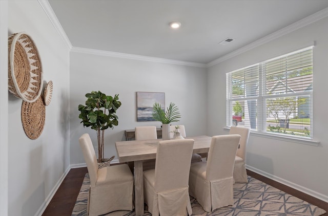 dining room featuring wood-type flooring and ornamental molding