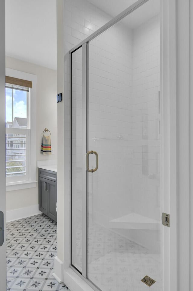 1821 Mead Ln, Johns Island, SC 29455 - bathroom featuring tile patterned floors, a stall shower, and baseboards