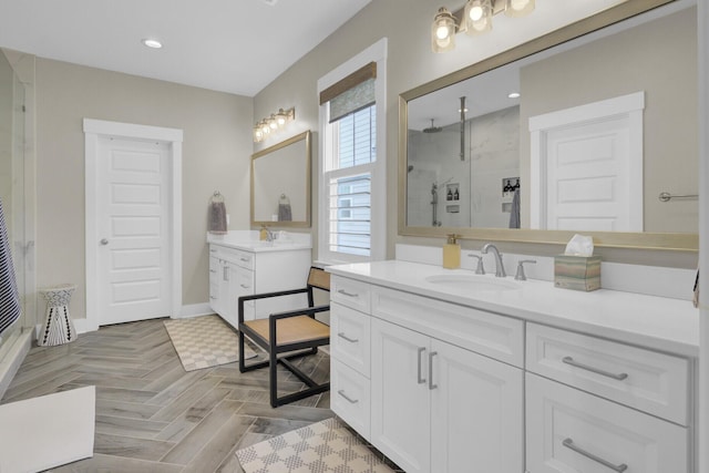 1821 Mead Ln, Johns Island, SC 29455 - bathroom featuring a shower stall, two vanities, baseboards, and recessed lighting