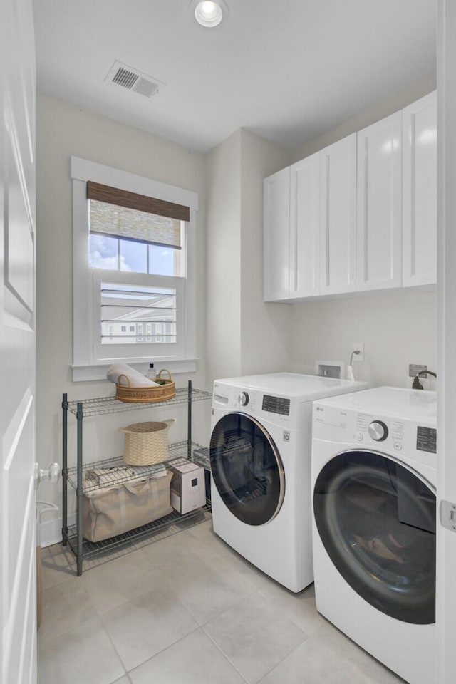 1821 Mead Ln, Johns Island, SC 29455 - laundry area with cabinet space, separate washer and dryer, light tile patterned floors, and recessed lighting