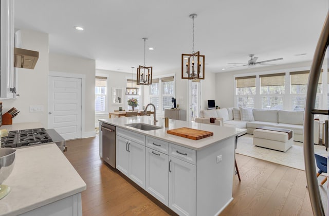 1821 Mead Ln, Johns Island, SC 29455 - kitchen featuring a sink, stainless steel dishwasher, a chandelier, white cabinets, and wood finished floors