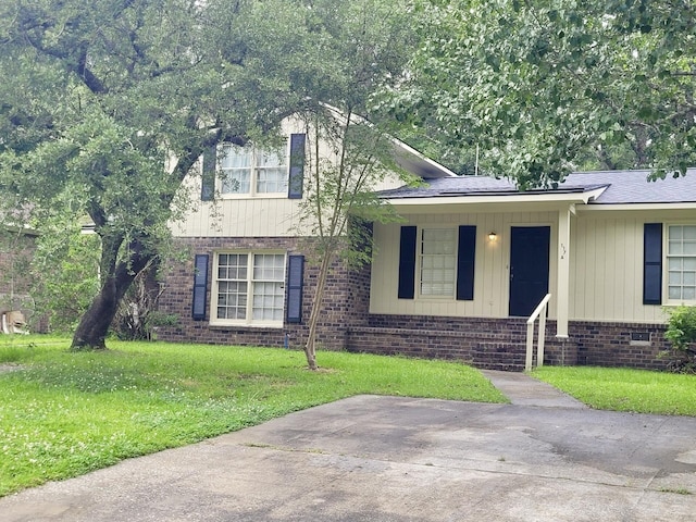 117 Roberta Dr Unit A/B, Summerville, SC 29485 - split level home with a front yard, covered porch, and brick siding
