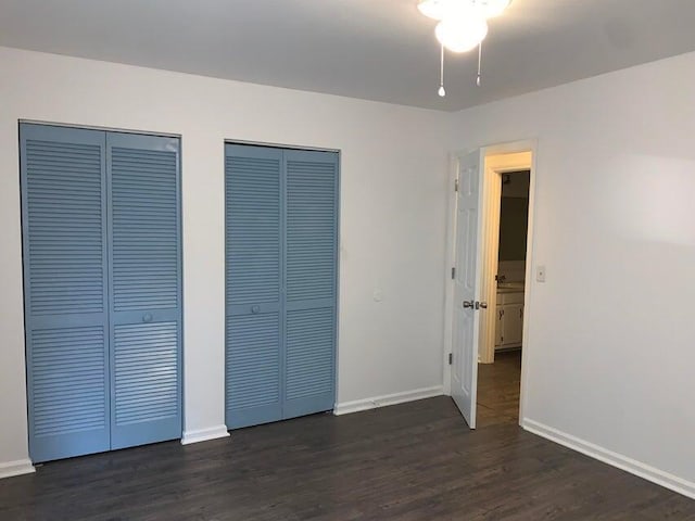 117 Roberta Dr Unit A/B, Summerville, SC 29485 - unfurnished bedroom with multiple closets, dark wood-style floors, and baseboards