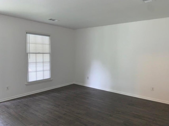 117 Roberta Dr Unit A/B, Summerville, SC 29485 - spare room featuring dark wood-style flooring, healthy amount of natural light, and baseboards