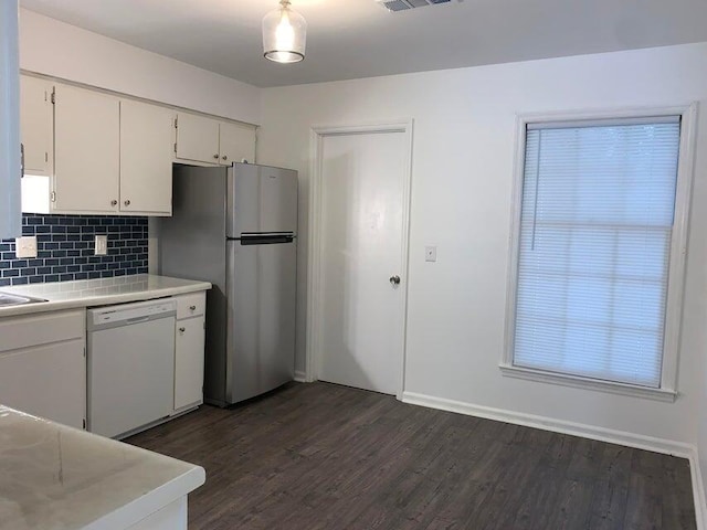 117 Roberta Dr Unit A/B, Summerville, SC 29485 - kitchen with white dishwasher, freestanding refrigerator, light countertops, decorative backsplash, and dark wood finished floors
