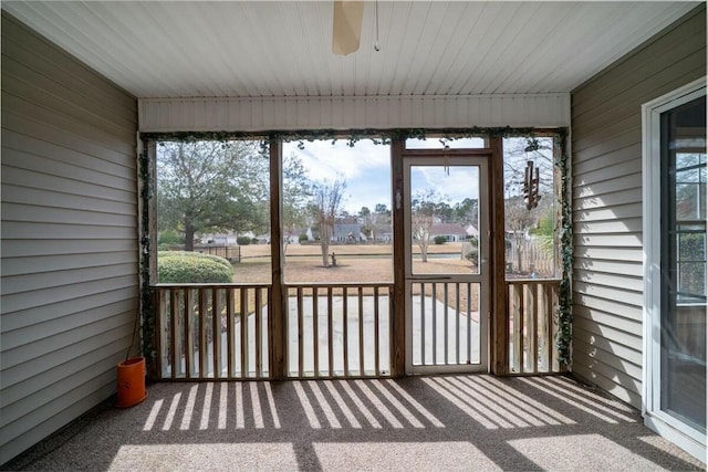 unfurnished sunroom featuring a wealth of natural light