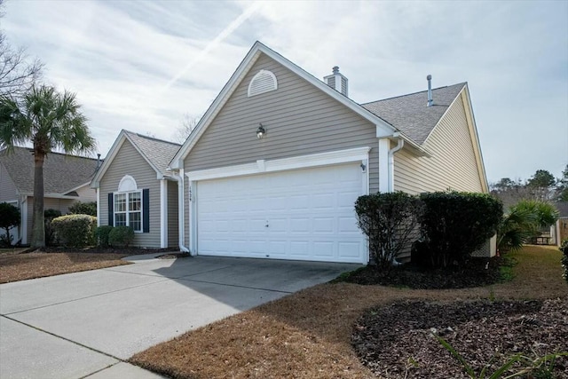 single story home featuring roof with shingles, driveway, and an attached garage