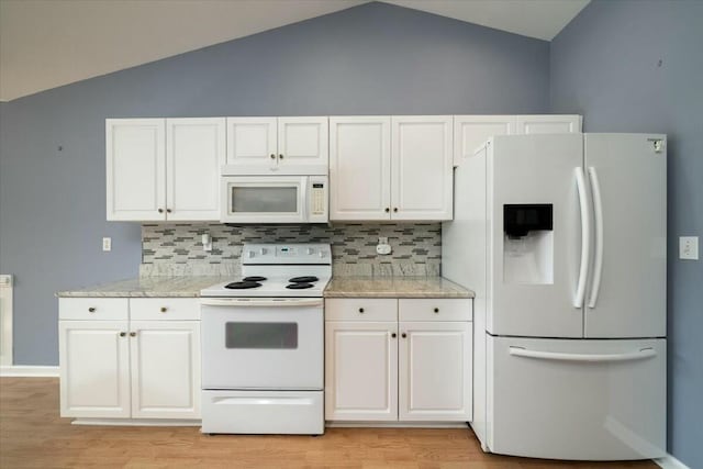 kitchen with white appliances, light wood-style floors, white cabinetry, and decorative backsplash