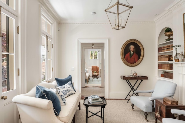 12 Orange St, Charleston, SC 29401 - sitting room with ornamental molding, baseboards, and built in shelves