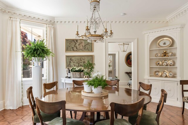 12 Orange St, Charleston, SC 29401 - dining room featuring crown molding and a chandelier