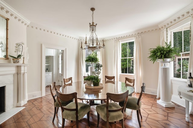 12 Orange St, Charleston, SC 29401 - dining room featuring a high end fireplace, ornamental molding, a notable chandelier, and baseboards