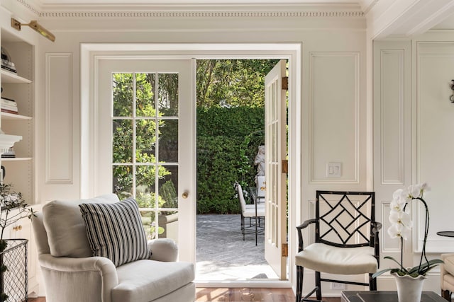 12 Orange St, Charleston, SC 29401 - entryway with a decorative wall, crown molding, and wood finished floors