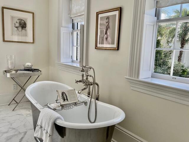12 Orange St, Charleston, SC 29401 - bathroom with marble finish floor and a freestanding tub