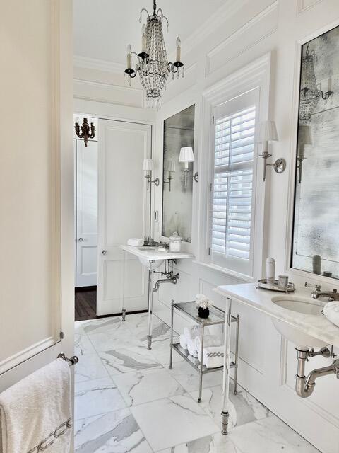 12 Orange St, Charleston, SC 29401 - bathroom with a chandelier, marble finish floor, and ornamental molding