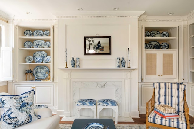 12 Orange St, Charleston, SC 29401 - sitting room with crown molding, wood finished floors, and built in shelves