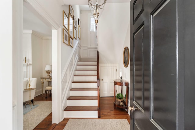 12 Orange St, Charleston, SC 29401 - entryway featuring dark wood-style flooring, a decorative wall, and stairs