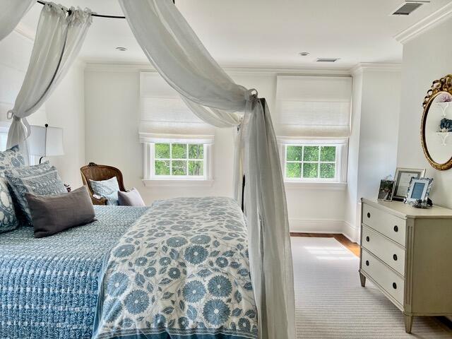 12 Orange St, Charleston, SC 29401 - bedroom featuring crown molding, visible vents, and multiple windows