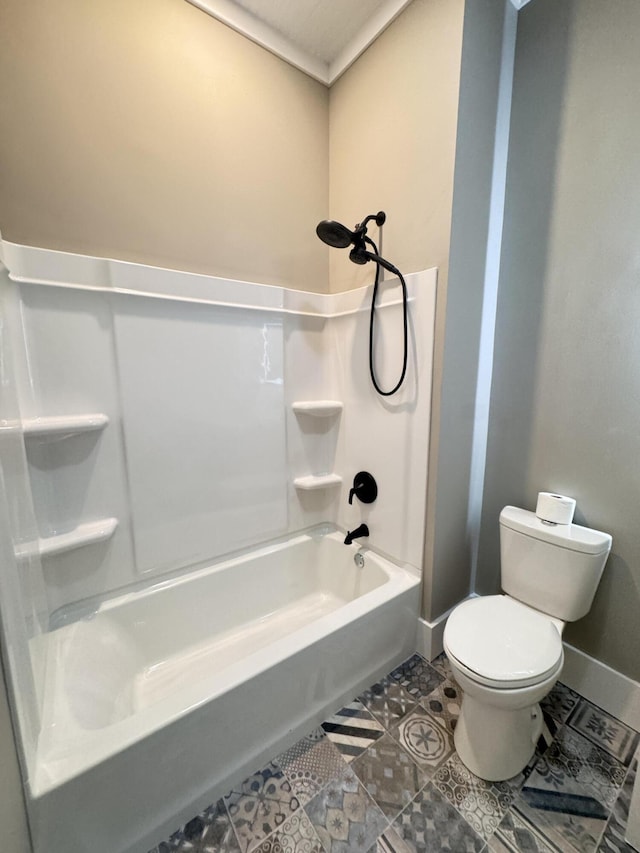full bath with baseboards, shower / bath combination, tile patterned flooring, and toilet