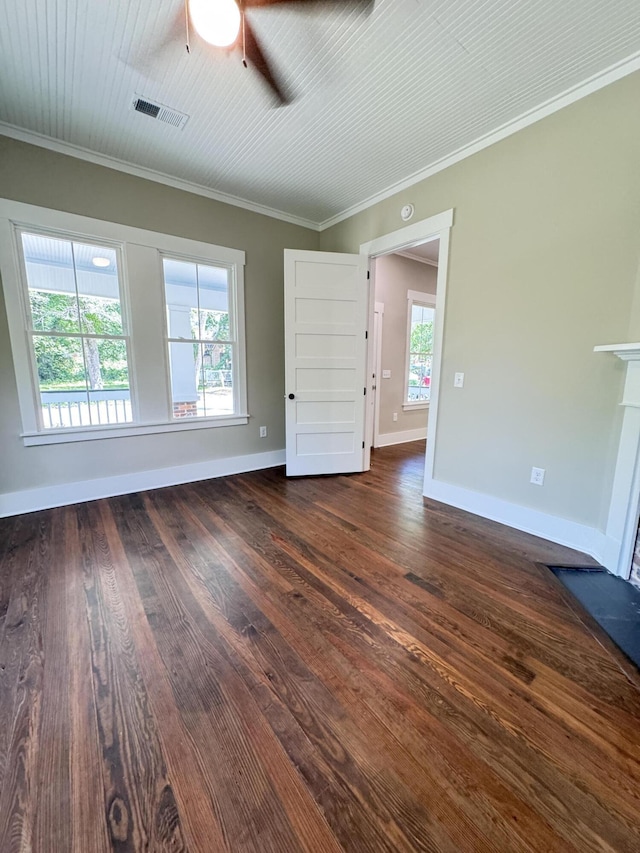empty room featuring visible vents, dark wood finished floors, ceiling fan, and baseboards