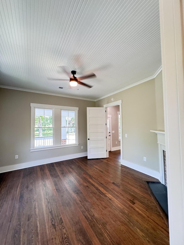unfurnished living room with ornamental molding, baseboards, ceiling fan, dark wood-style floors, and a fireplace with flush hearth