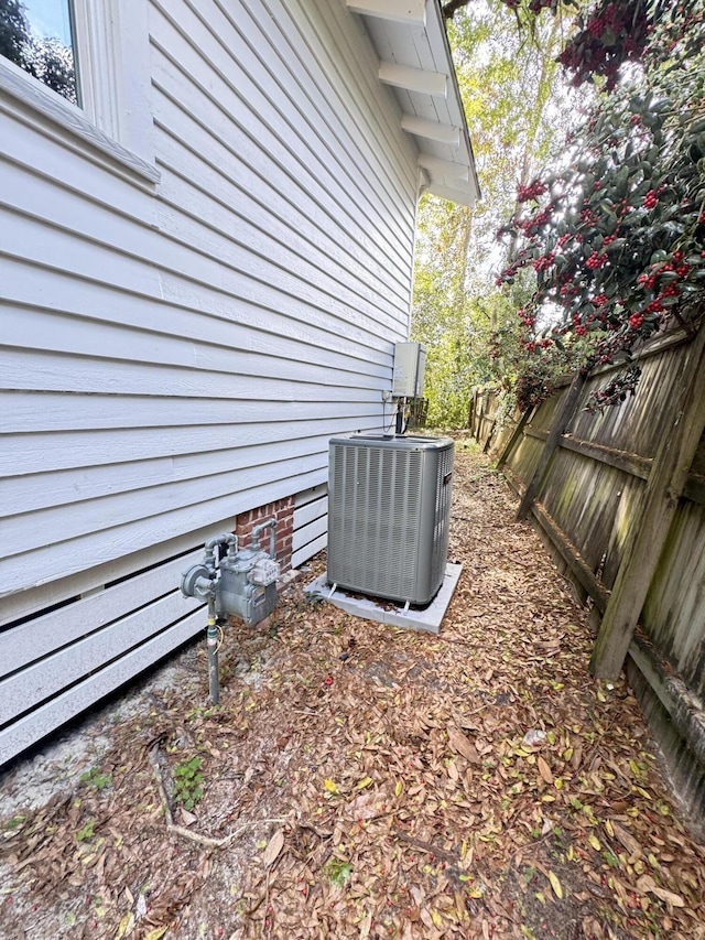 details featuring central AC and fence