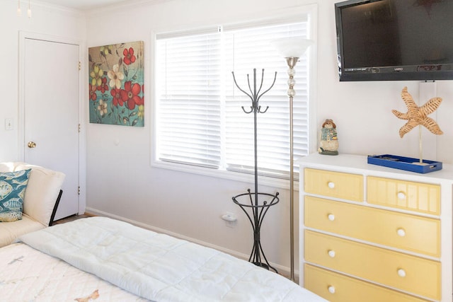 bedroom with crown molding