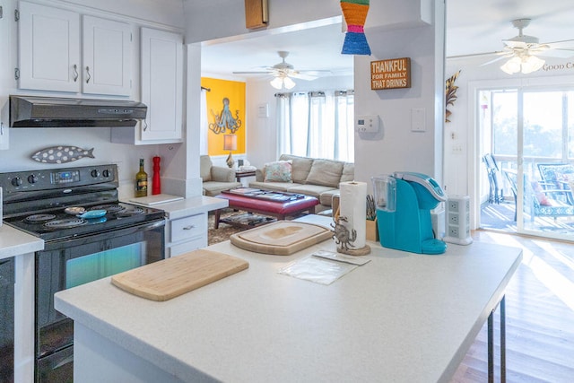 kitchen with electric range, ceiling fan, white cabinets, and light hardwood / wood-style flooring