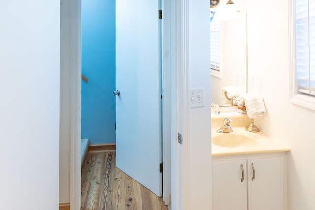 bathroom featuring hardwood / wood-style floors and vanity