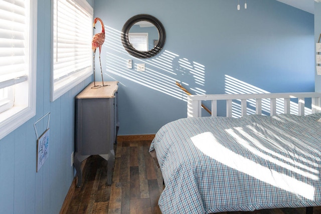 bedroom featuring dark wood-type flooring