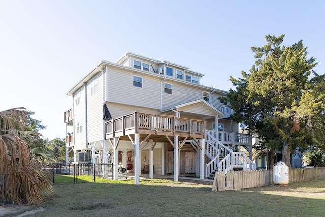 view of front of property featuring a front lawn and a deck