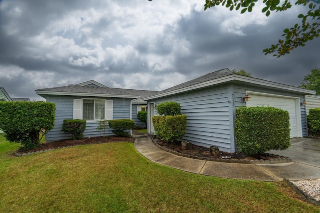 ranch-style house with a garage, an outbuilding, and a front yard