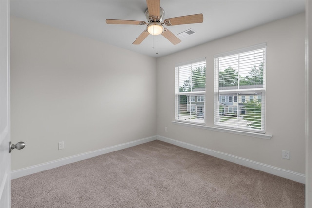 7780 Montview Rd, North Charleston, SC 29418 - unfurnished room featuring light carpet, baseboards, and a ceiling fan