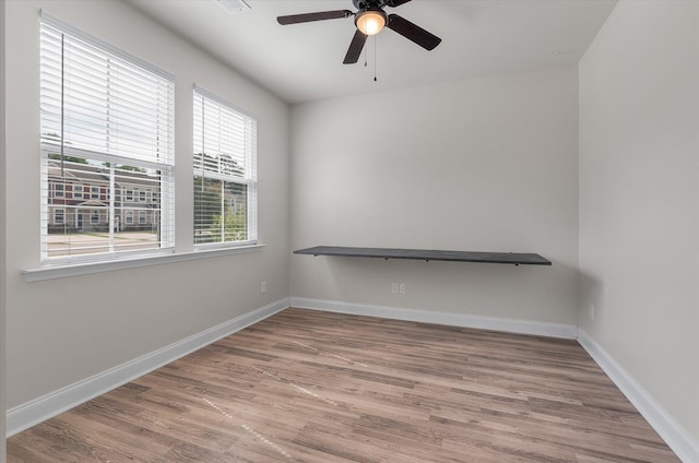 7780 Montview Rd, North Charleston, SC 29418 - spare room featuring ceiling fan, wood finished floors, and baseboards